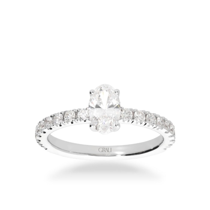 White Gold Solitaire Ring with Oval Diamond and Side Diamonds