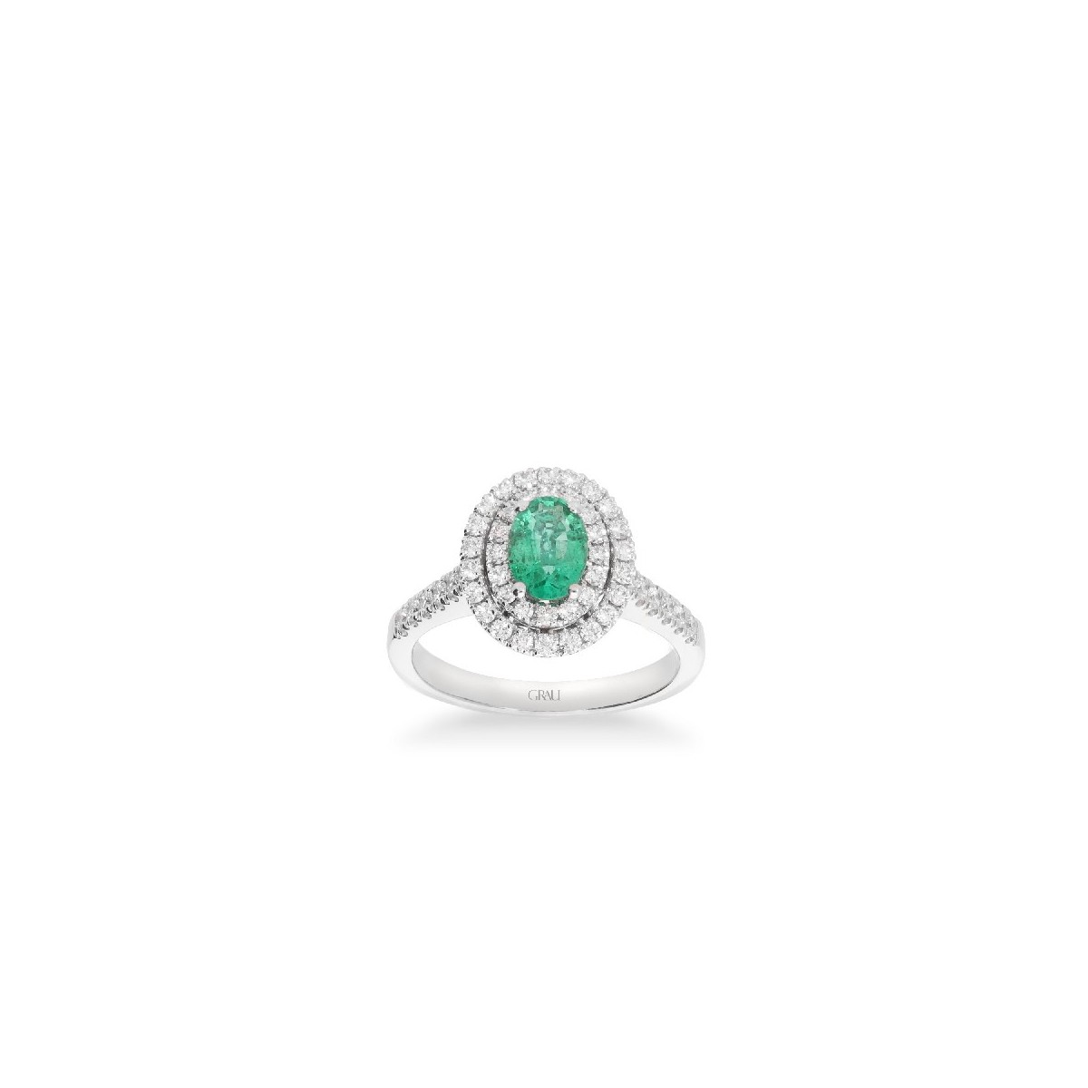 White gold rosette ring with oval Emerald and double halo of Diamonds