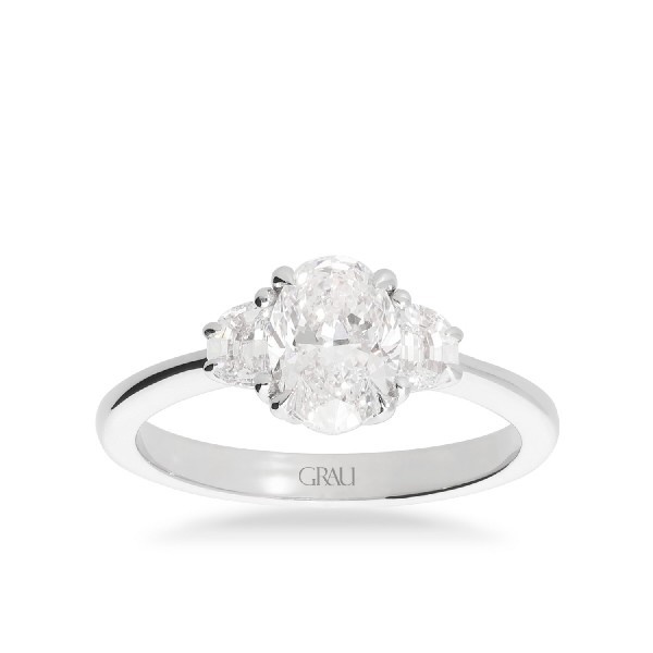 Anell d’Or Blanc amb Diamant Oval de 1.20 ct i Diamants Mitja Lluna