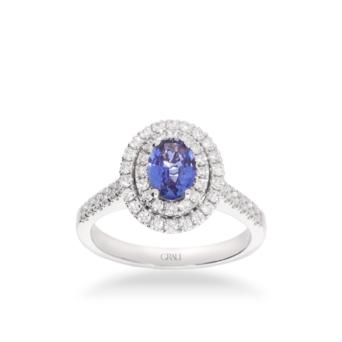 Rosette ring with oval-cut blue sapphire (0.77ct) and double halo of diamonds