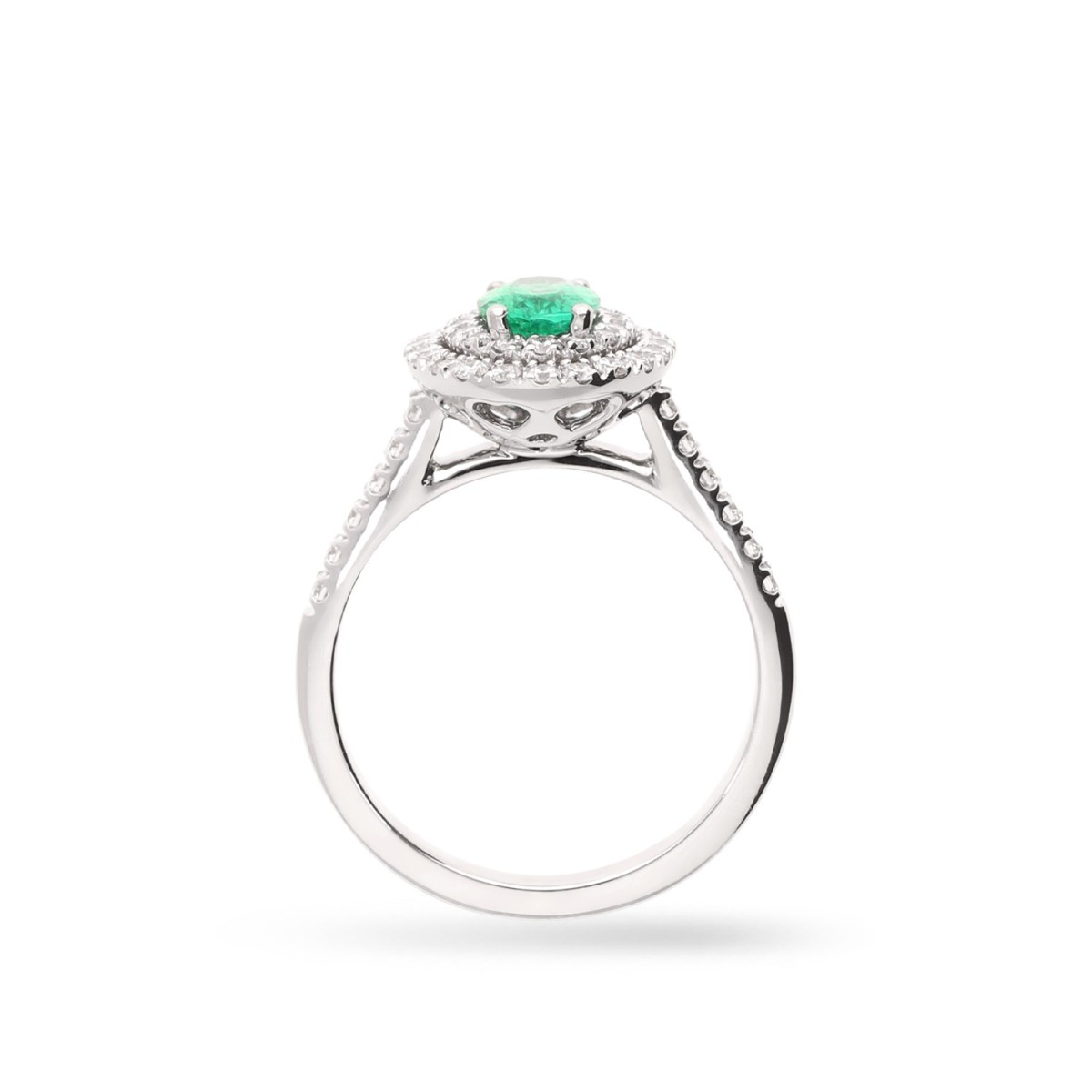 White gold rosette ring with oval Emerald and double halo of Diamonds